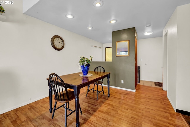 dining space with recessed lighting, baseboards, and light wood-style flooring