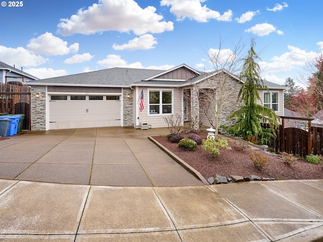 ranch-style home with board and batten siding, concrete driveway, fence, and a garage