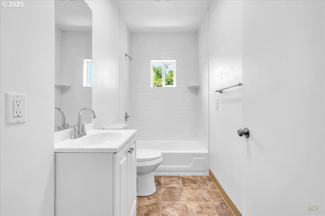 full bath featuring vanity, toilet, baseboards, and shower / bath combination