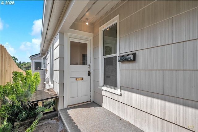 doorway to property with fence