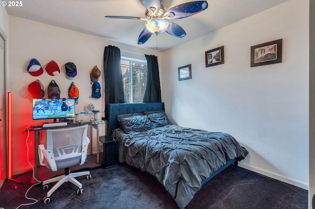 bedroom with dark colored carpet and ceiling fan