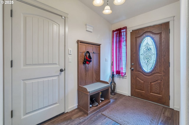 mudroom featuring wood finished floors and baseboards