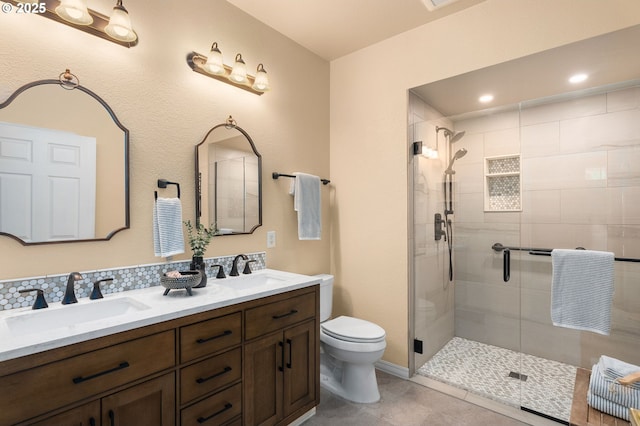 1231 NE Horizon Loop Unit 203, Hillsboro, OR 97124 - bathroom with toilet, a stall shower, double vanity, and tile patterned flooring