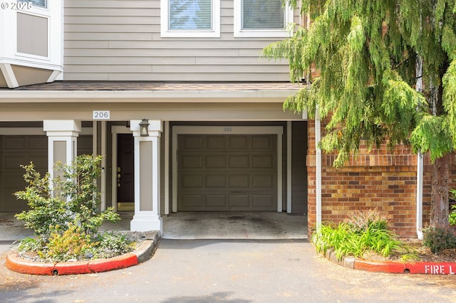 1231 NE Horizon Loop Unit 203, Hillsboro, OR 97124 - garage with asphalt driveway