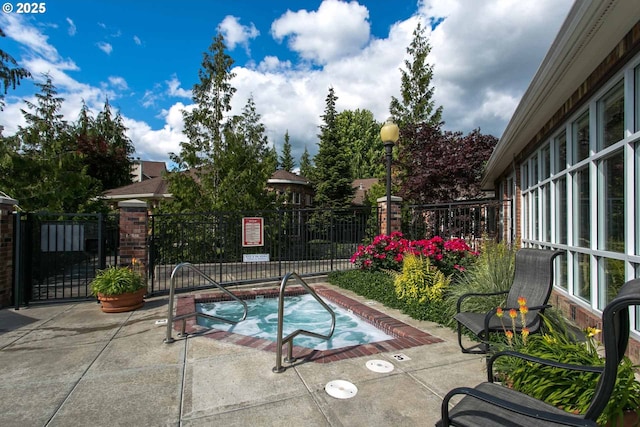 1231 NE Horizon Loop Unit 203, Hillsboro, OR 97124 - view of pool with a community hot tub, a patio area, and a gate
