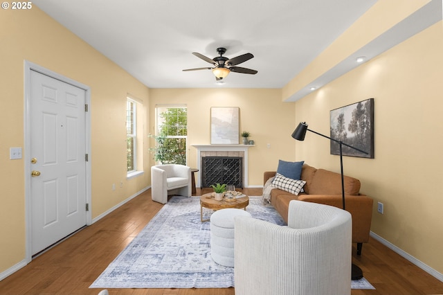 1231 NE Horizon Loop Unit 203, Hillsboro, OR 97124 - living area with wood finished floors, baseboards, ceiling fan, and a fireplace