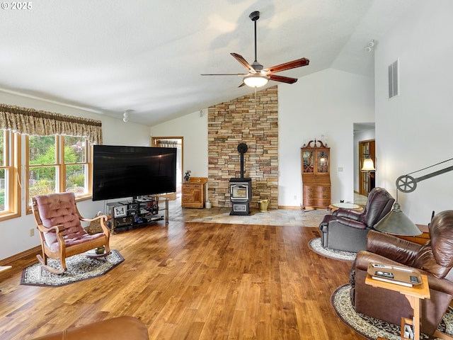 23456 S Schieffer Rd, Colton, OR 97017 - living area featuring a wood stove, wood finished floors, ceiling fan, and high vaulted ceiling