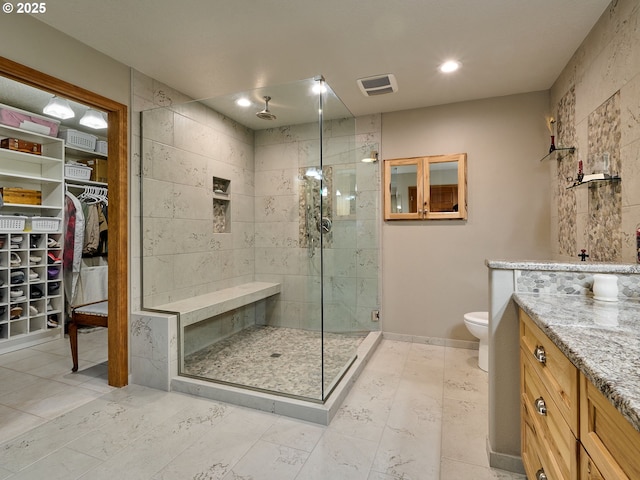 23456 S Schieffer Rd, Colton, OR 97017 - bathroom with a stall shower, toilet, vanity, a spacious closet, and recessed lighting