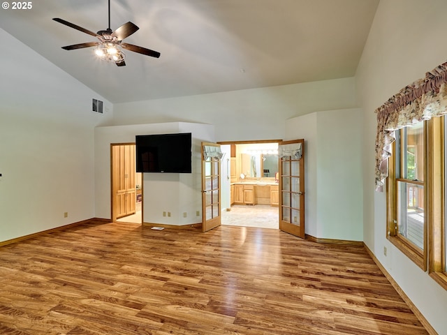 23456 S Schieffer Rd, Colton, OR 97017 - unfurnished room with high vaulted ceiling, wood finished floors, french doors, and a ceiling fan