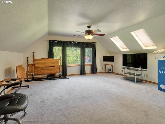 23456 S Schieffer Rd, Colton, OR 97017 - sitting room with a skylight, lofted ceiling, ceiling fan, carpet floors, and a textured ceiling