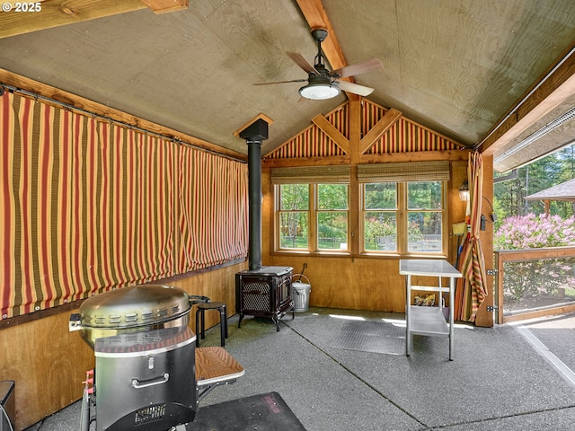 23456 S Schieffer Rd, Colton, OR 97017 - miscellaneous room with a wood stove, a ceiling fan, plenty of natural light, and lofted ceiling