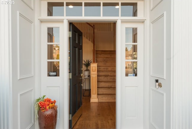 doorway with dark hardwood / wood-style flooring