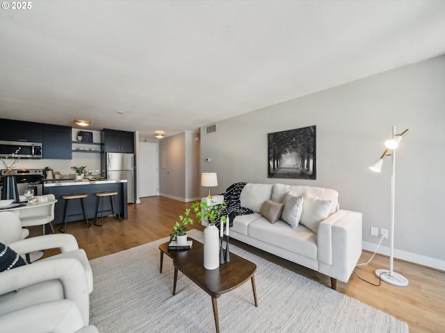 255 SW Harrison St Unit 9C, Portland, OR 97201 - living area featuring wood finished floors and baseboards