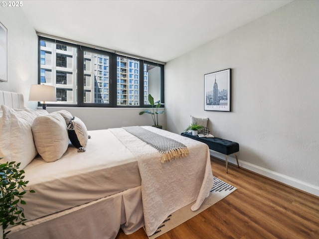 255 SW Harrison St Unit 9C, Portland, OR 97201 - bedroom with wood finished floors and baseboards