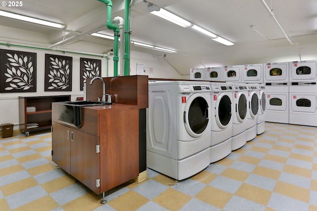 255 SW Harrison St Unit 9C, Portland, OR 97201 - shared laundry room featuring light floors, washing machine and dryer, and stacked washer and clothes dryer