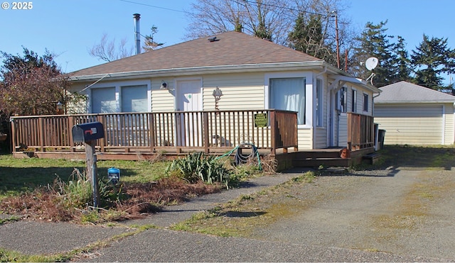 view of property exterior with a deck