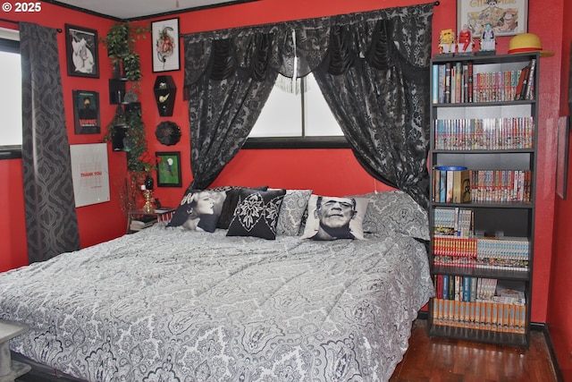 bedroom with wood-type flooring