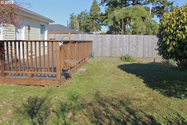 view of yard featuring a wooden deck