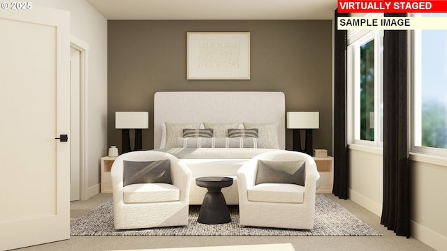 carpeted bedroom with baseboards