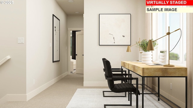 carpeted home office with baseboards