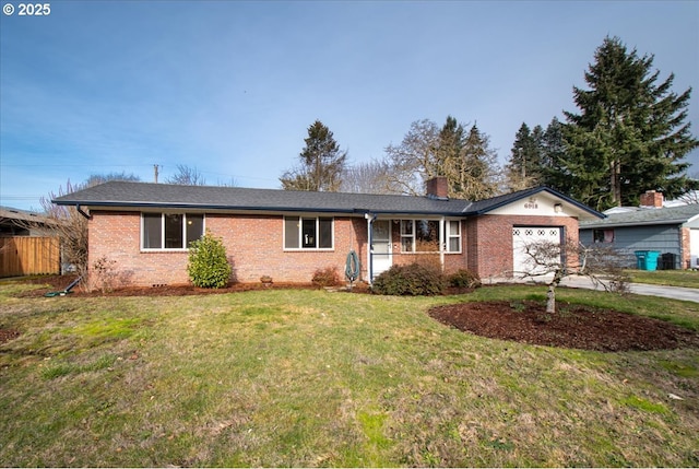 single story home with a garage and a front lawn