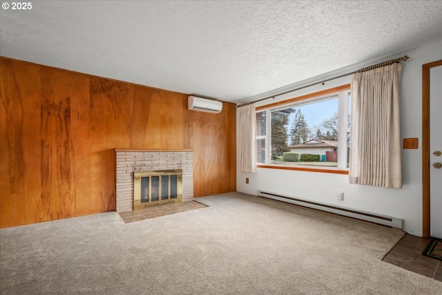 unfurnished living room with wooden walls, a wall mounted air conditioner, a fireplace, and baseboard heating