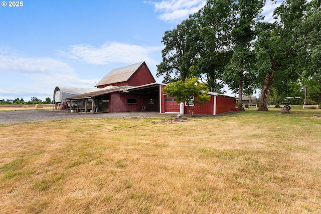 8747 S Heinz Rd, Canby, OR 97013 - view of side of property with a yard, an outdoor structure, a pole building, and a carport