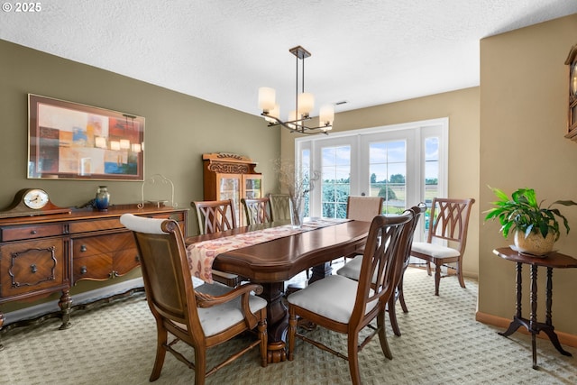 8747 S Heinz Rd, Canby, OR 97013 - dining area featuring a chandelier, light carpet, and a textured ceiling