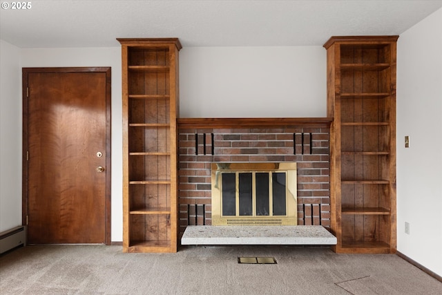 unfurnished living room featuring a brick fireplace, carpet floors, and baseboard heating