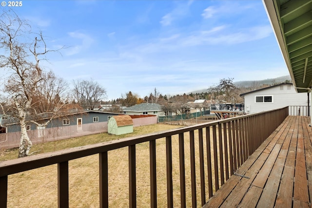 wooden deck with a shed