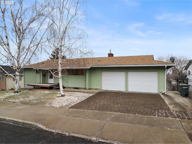 single story home with a garage