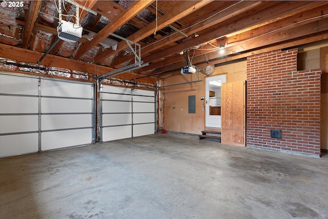 garage featuring a garage door opener and electric panel