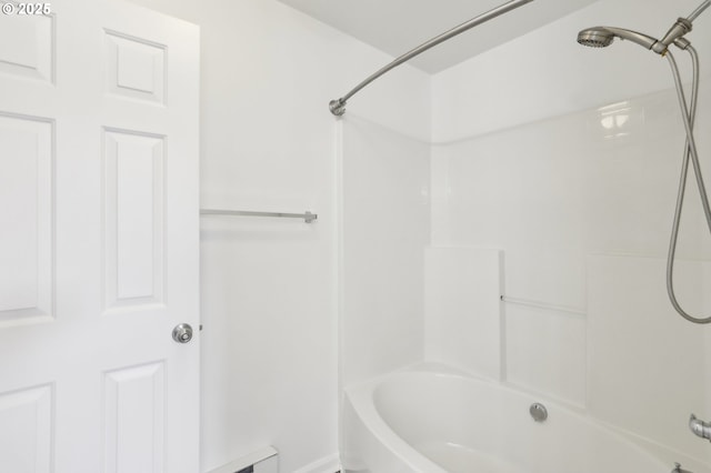 bathroom with bathing tub / shower combination