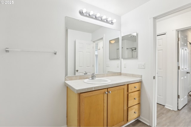 bathroom featuring vanity and wood finished floors