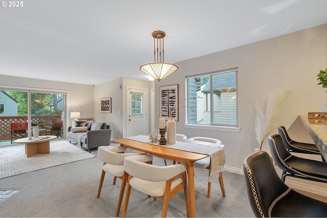 2805 NW Upshur St Unit B, Portland, OR 97210 - dining area with carpet flooring and healthy amount of natural light