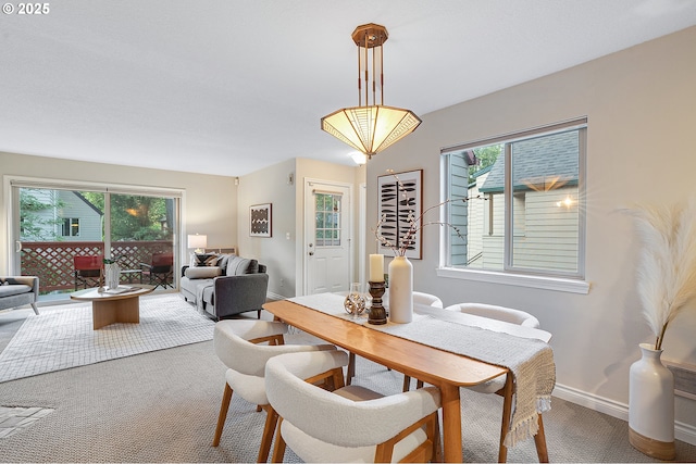 2805 NW Upshur St Unit B, Portland, OR 97210 - dining room featuring carpet and healthy amount of natural light