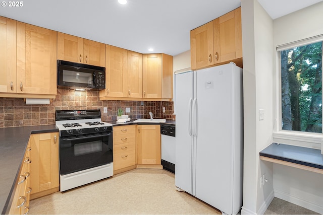 2805 NW Upshur St Unit B, Portland, OR 97210 - kitchen with white appliances, dark countertops, light brown cabinets, decorative backsplash, and recessed lighting