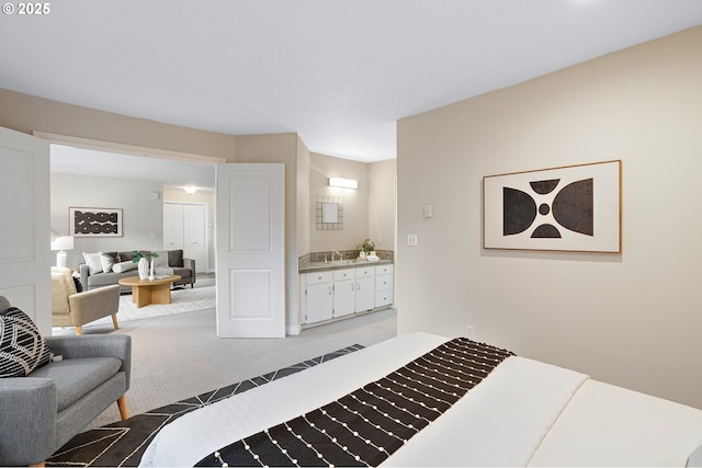 2805 NW Upshur St Unit B, Portland, OR 97210 - carpeted bedroom featuring a sink and baseboards