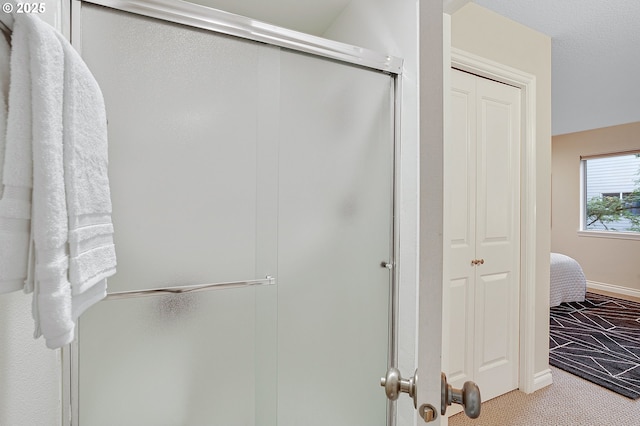 2805 NW Upshur St Unit B, Portland, OR 97210 - full bathroom featuring a shower stall, a closet, and ensuite bath