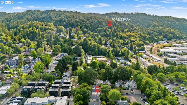 2805 NW Upshur St Unit B, Portland, OR 97210 - aerial view of property and surrounding area with a forest and nearby suburban area
