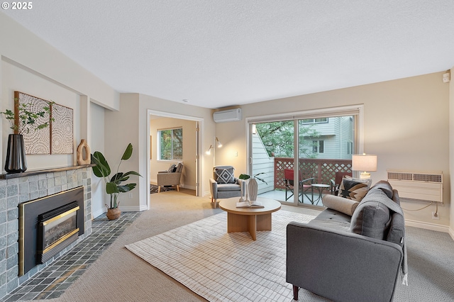2805 NW Upshur St Unit B, Portland, OR 97210 - living room with carpet floors, a wall unit AC, a fireplace with flush hearth, and a textured ceiling