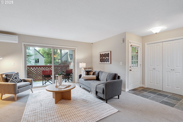 2805 NW Upshur St Unit B, Portland, OR 97210 - living room featuring a wall mounted AC, carpet floors, and a textured ceiling