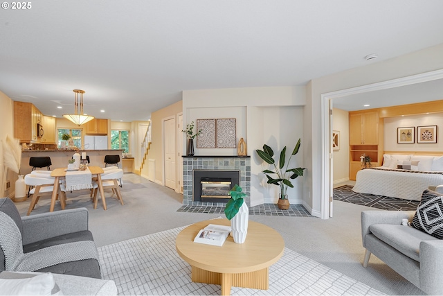 2805 NW Upshur St Unit B, Portland, OR 97210 - living area with light colored carpet, stairway, a tile fireplace, and recessed lighting