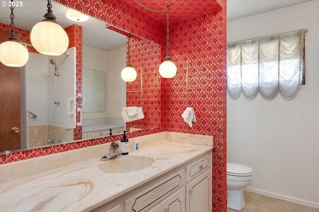 bathroom featuring tile patterned flooring, vanity, a textured ceiling, and toilet
