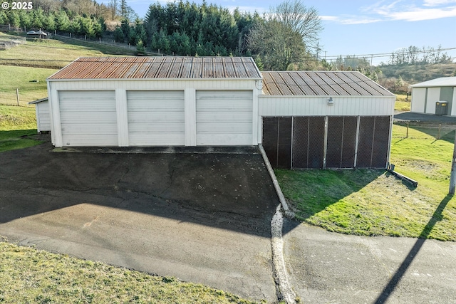 garage with a yard