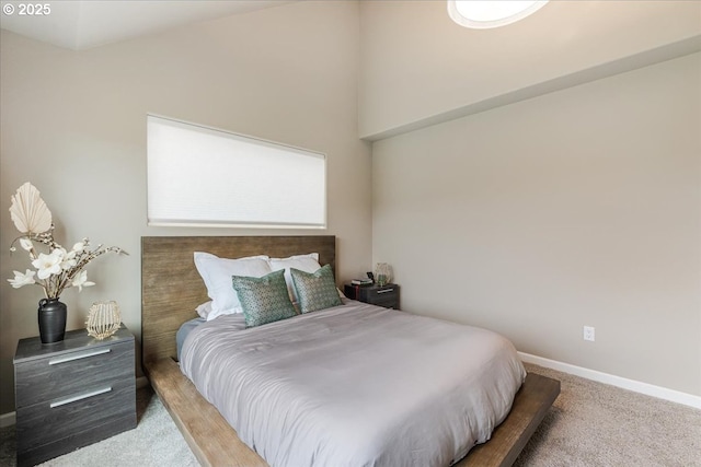 carpeted bedroom featuring baseboards