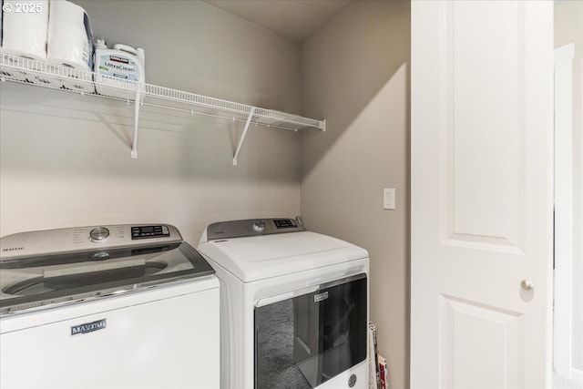laundry room with independent washer and dryer