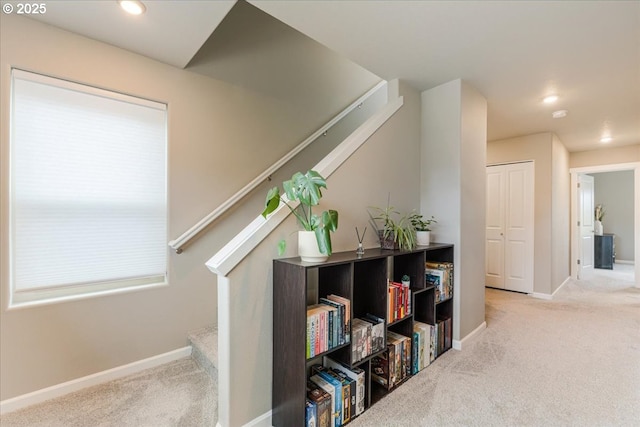 hall featuring carpet floors, stairway, baseboards, and recessed lighting