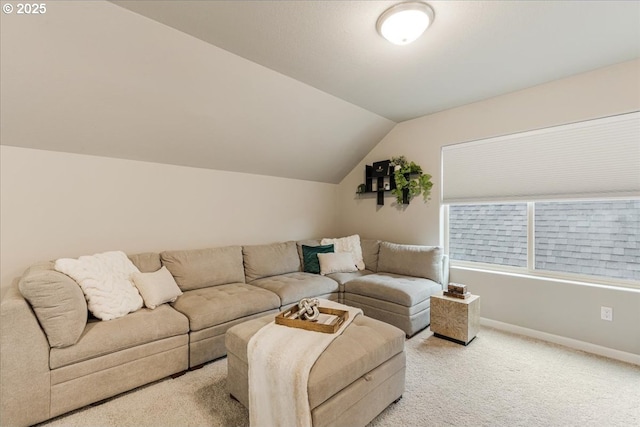 living room featuring light colored carpet, vaulted ceiling, and baseboards