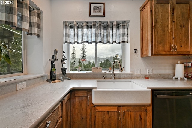 kitchen with dishwasher, plenty of natural light, and sink